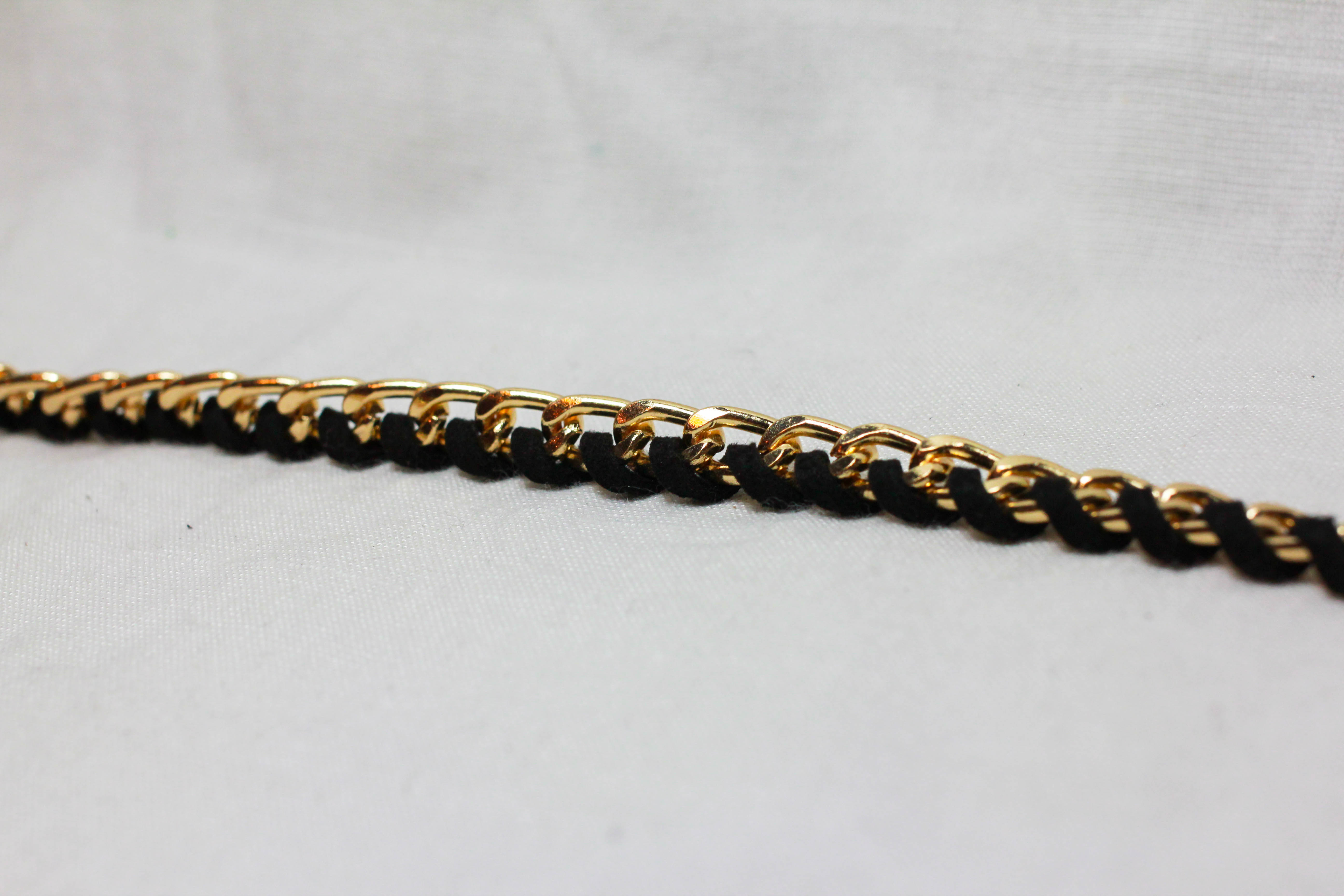 เข็มขัดแฟชั่น แนวเชือกปลายมีพู่ สีดำขอบทองสวย