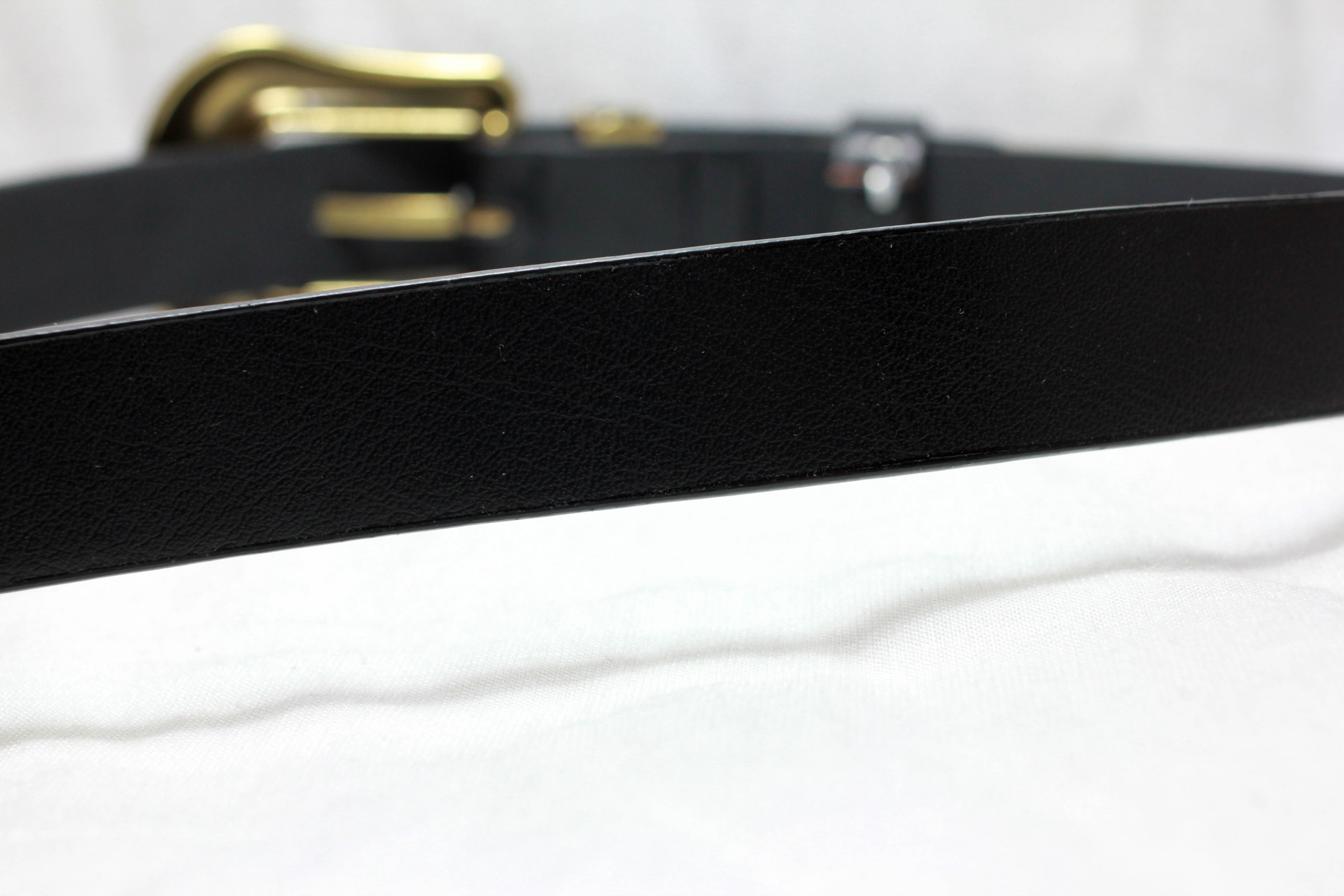 เข็มขัดสองหัวสีทอง หัวมลรูปดอกไม้ สายเรียบกว้าง 1 นิ้ว