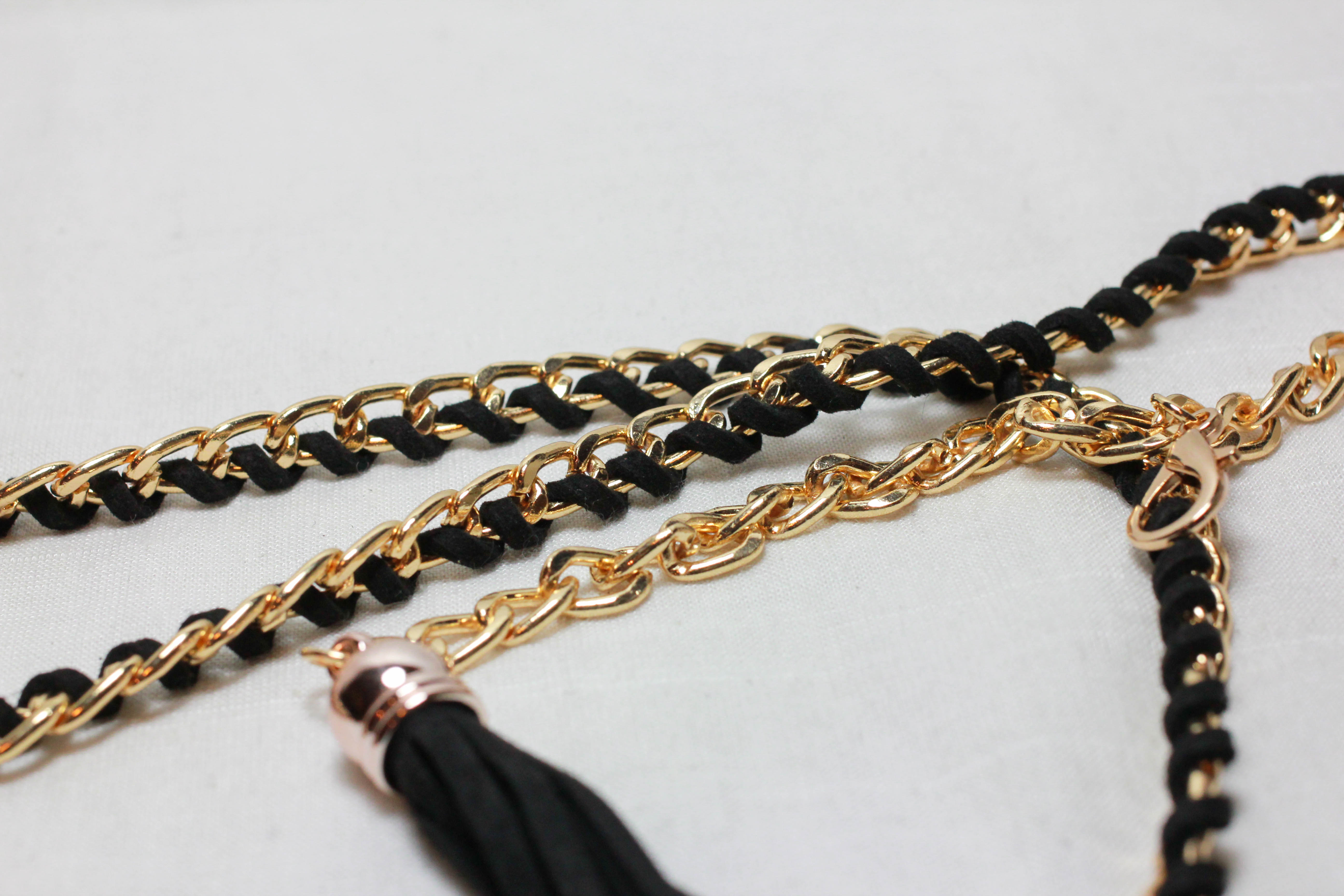 เข็มขัดแฟชั่น แนวเชือกปลายมีพู่ สีดำขอบทองสวย